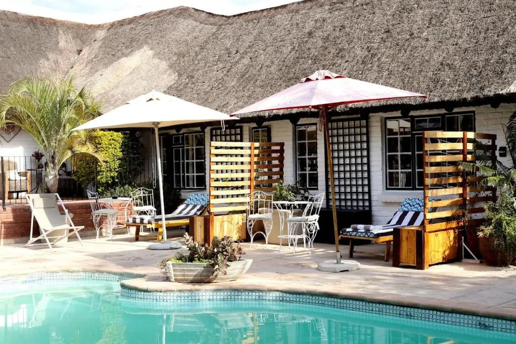 Sun loungers and umbrellas on the pool terrace