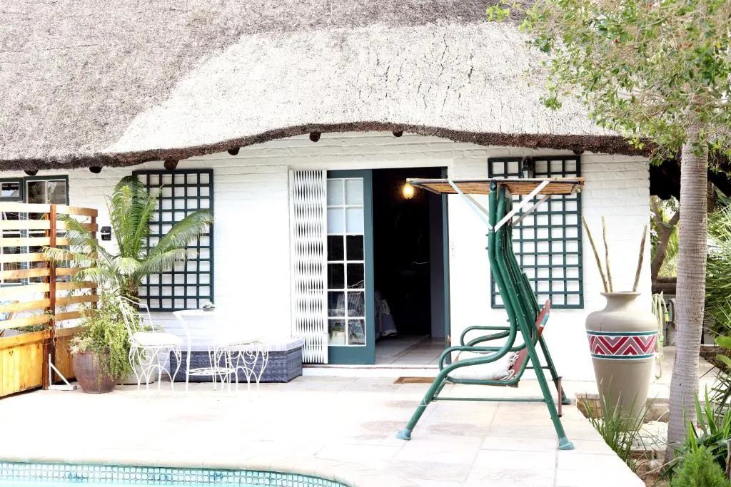 The private entrance to a thatched guest suite